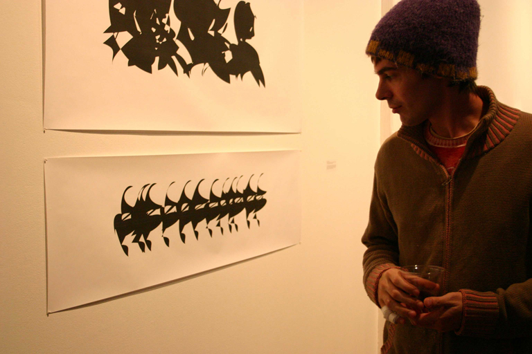 An appreciator of the fine arts looks intently at my work during the VOID show at Gallery Fresh in 2007.